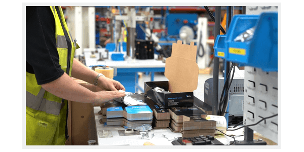 An AIRFORCE MK4 and calibration certificate being packed into a box